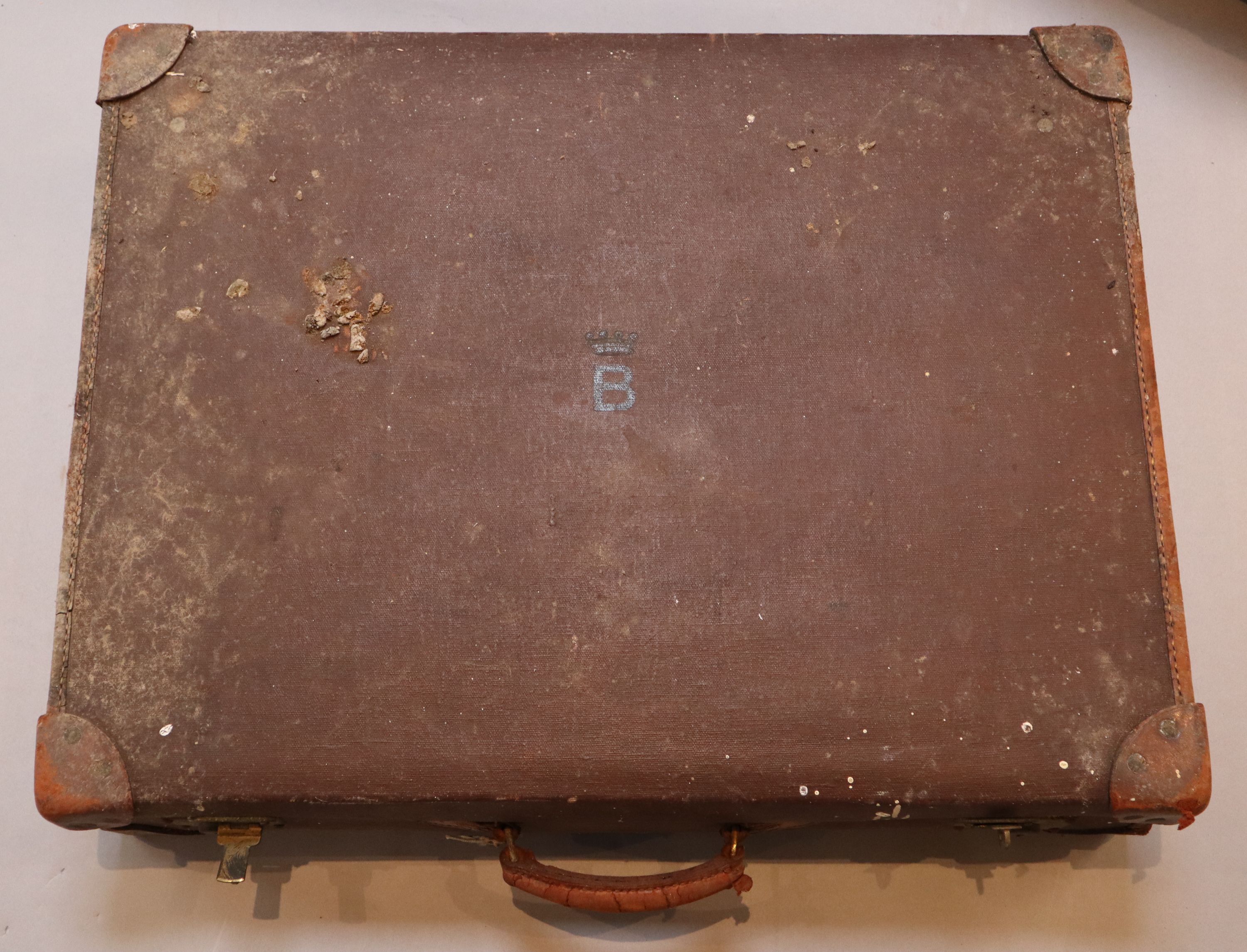 A group of three tan leather suitcases, one inscribed Brabourne, another Marchioness of Sligo